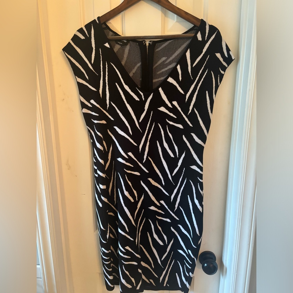 Knee length black and white sweater dress. Thick material. Great for the winter